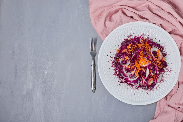 Vegetable salad sliced on blue