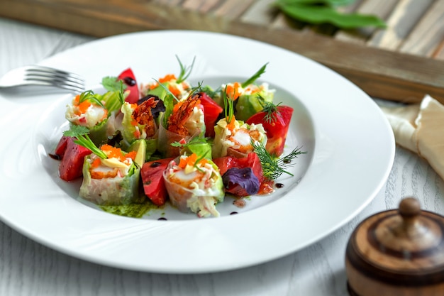 Vegetable salad topped with herbs