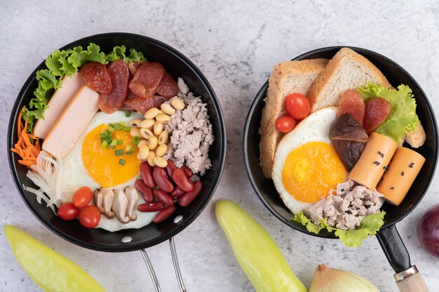 Vegetable salad with bread and boiled eggs in the pan.