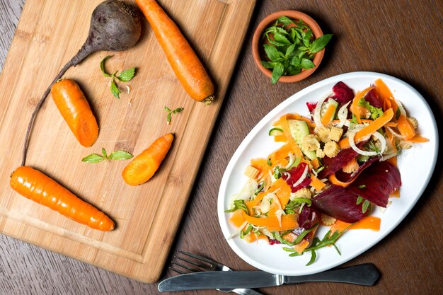 Vegetable salad with cucumber, corn, beetroot and arugula