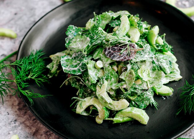 Vegetable salad with herbs and mayonnaise