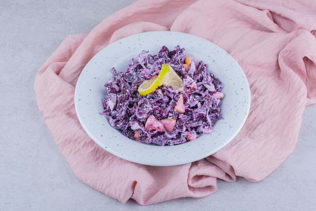 Vegetable salad with purple chopped cabbage and onions