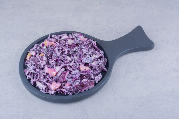 Vegetable salad with purple chopped cabbage and onions