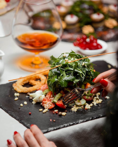 Vegetable salad with spinach on the table