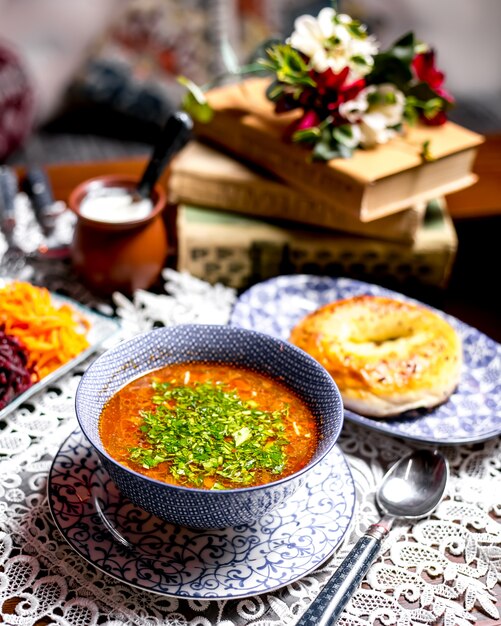 Vegetable soup bowl garnished with herbs