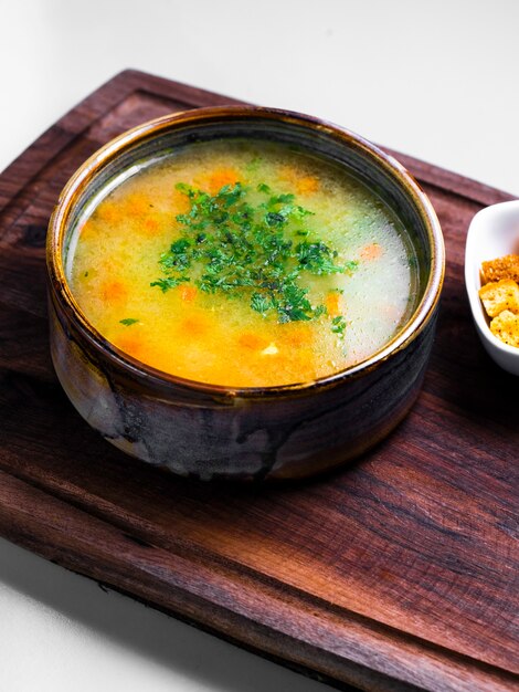 vegetable soup topped with chopped herbs