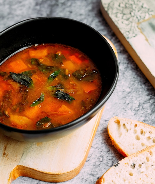 Vegetable soup with herbs inside