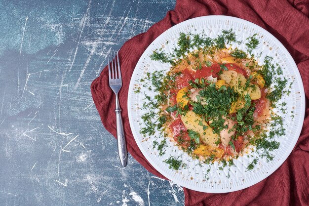 Vegetable stew in a white plate.