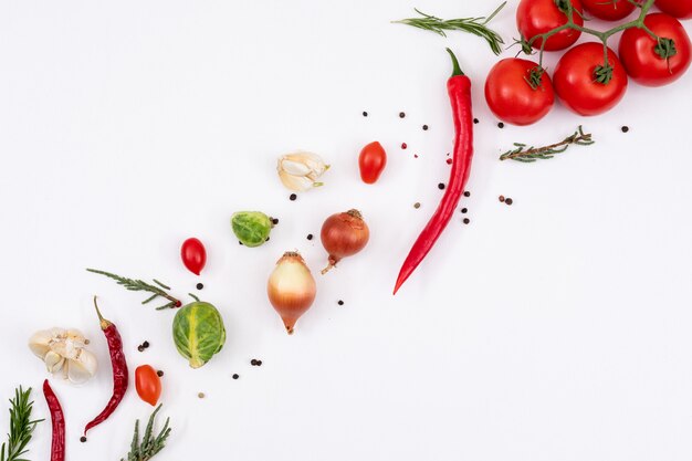 vegetables arranged from left to right on white