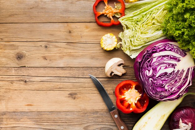 Vegetables assortment on wooden background with copy space