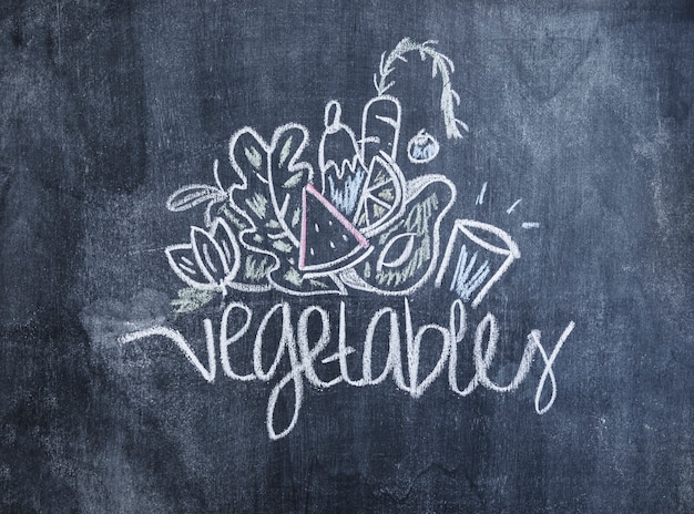 Vegetables drawn with chalk on blackboard