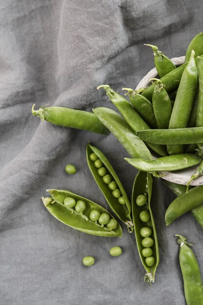 Vegetables. Green peas on the table