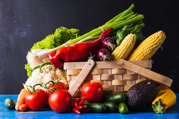 Free photo vegetables and herbs in basket