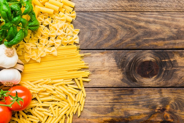 Vegetables and herbs on pasta