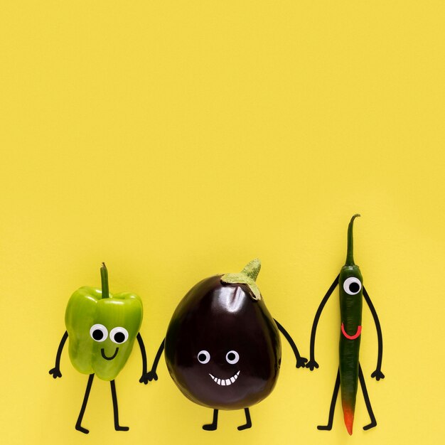 Vegetables holding hands with copy space