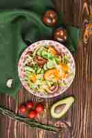 Free photo vegetables and napkin near salad