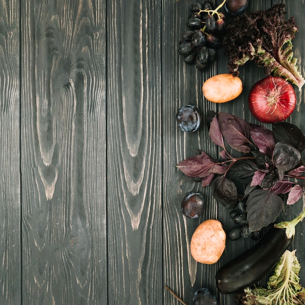 Vegetables on right side of wooden tabletop