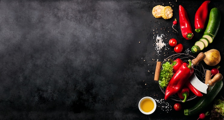 Free Photo vegetables set to the left of a black slate