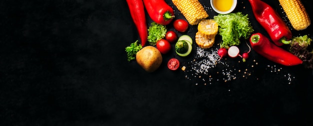 Free photo vegetables with salt and a corn cob