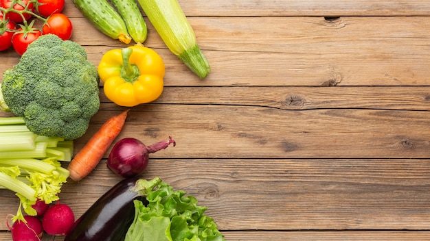 Vegetables on wooden table flat lay