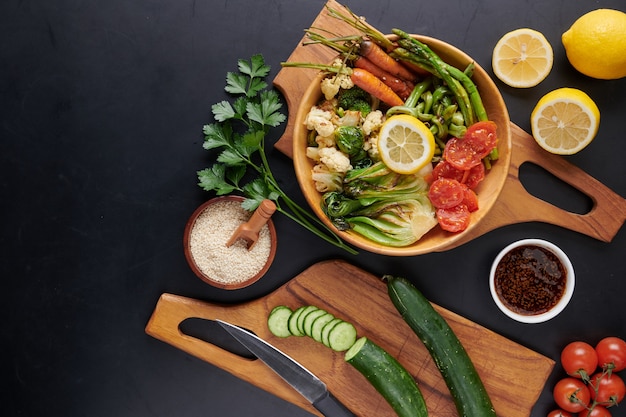 Vegetarian Buddha bowl with fresh vegetable salad and chickpea.