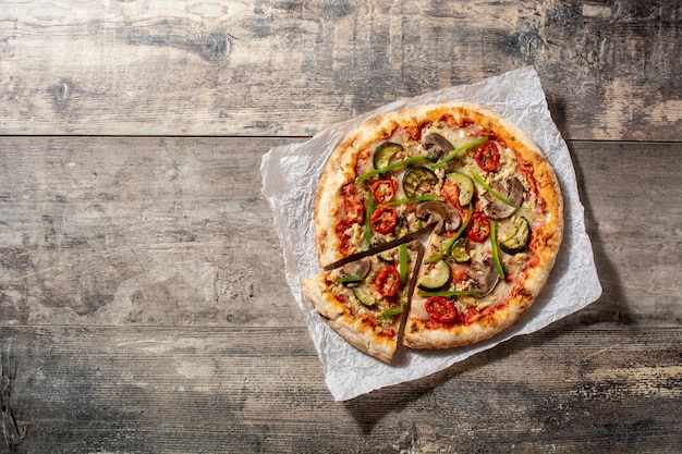 Vegetarian pizza with zucchini tomato peppers and mushrooms