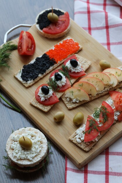 Vegeterian snack crackers on the wooden board.