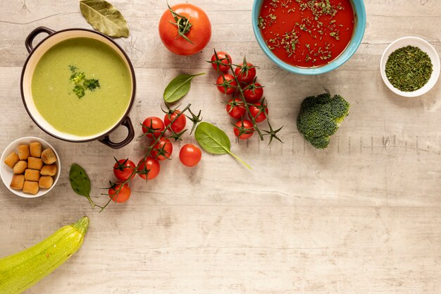 Veggies cream soups on wooden background