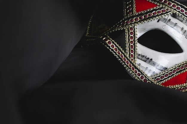 Venetian mask for eyes on a black fabric