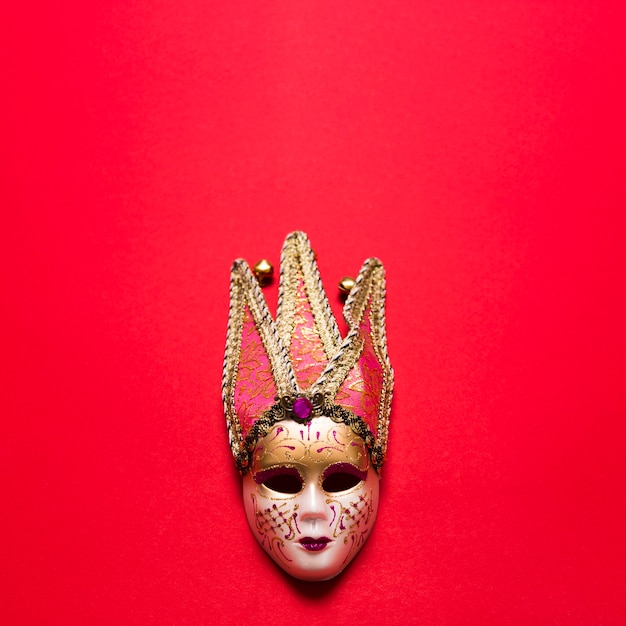 Venetian mask on red
