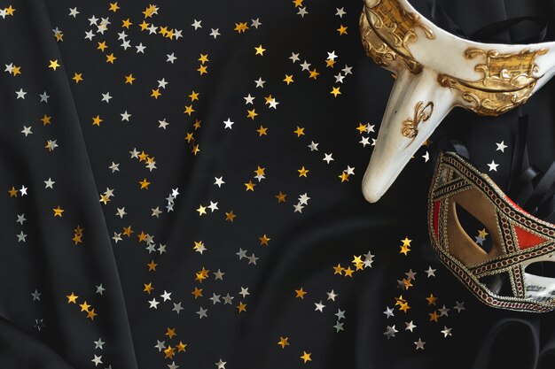 Venetian masks with star confetti