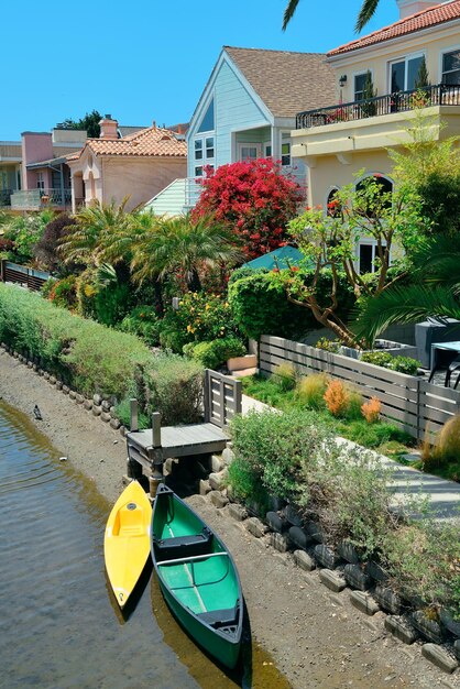 Venice Canals Walkway with river and boat in Los Angeles, California.