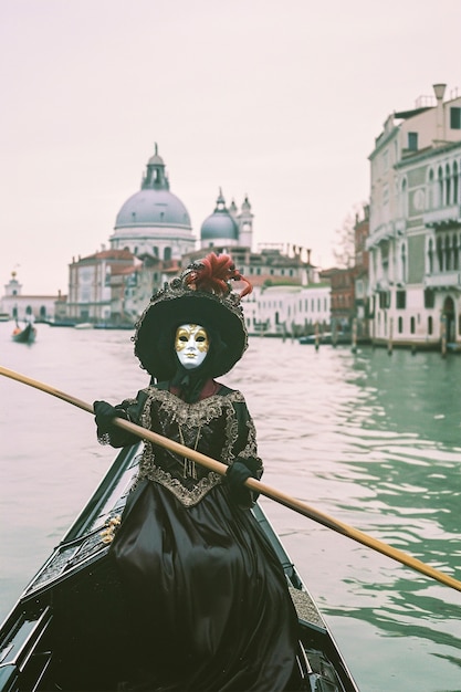 Venice carnival with people wearing traditional costumes with masks