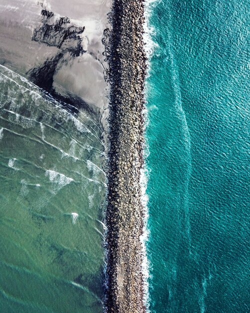 Vertical aerial shot of Columbia River meeting the Pacific Ocean at Fort Stevens