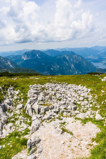 Vertical aerial shot of a rocky hillside on majestic mountains