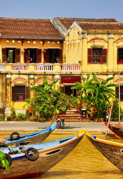 Vertical beautiful of buildings and boats in Hoi An, Vietnam