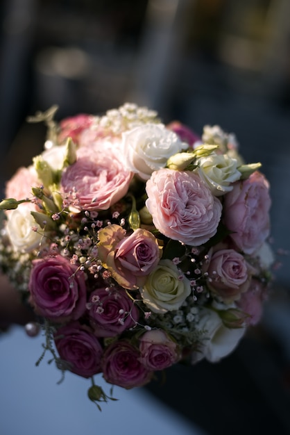 Vertical closeup shot of a colorful rose flower bouquet