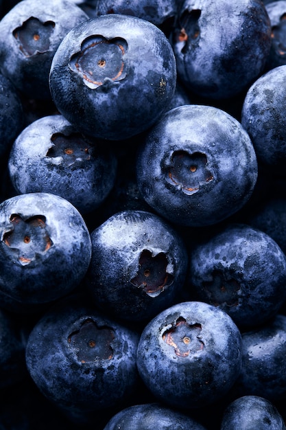 Vertical closeup shot of a lot of blueberries