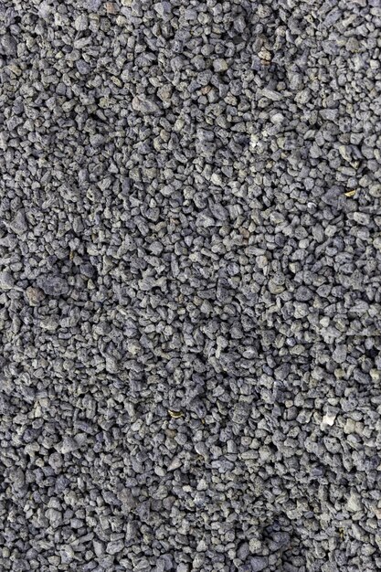 Vertical closeup of small stones under the sunlight - a nice picture for backgrounds and wallpapers