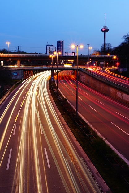 Vertical high angle shot of an illuminated highway at night