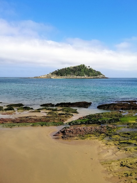 Vertical high angle shot of a mesmerizing beach scenery in San Sebastian, Spain