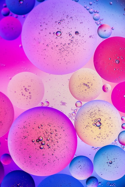 Free photo vertical illustration of aesthetic refreshing purple, pink and blue bubbles