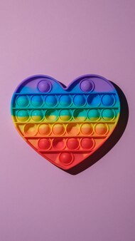 Premium Photo Vertical Image Of Pop It Fidget Toy On Pink Background Top View Premium Photo Vertical Image Of Pop It Fidget Toy On Pink Background Top View