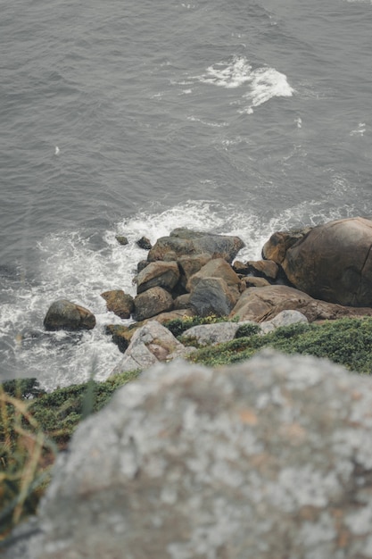 Vertical image of a rocky shore in Sao Francisco Do Sul, Brazil