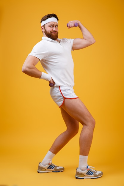 Free photo vertical image of sportsman showing bicep