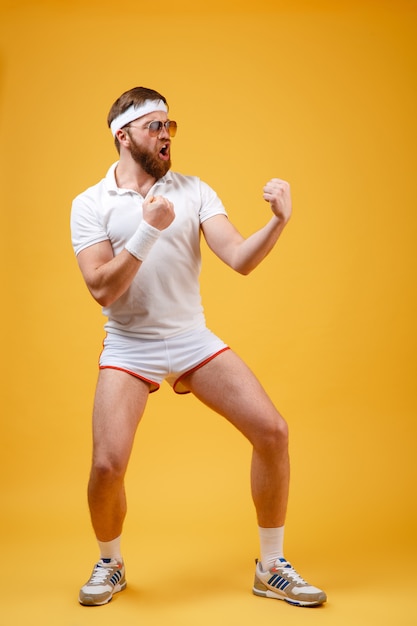 Vertical image of Sportsman in sunglasses Depicts a fighter