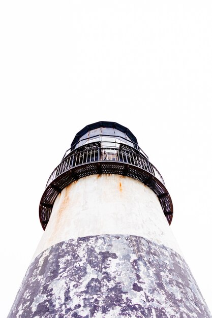 Vertical low angle shot of a lighthouse with a clear sky