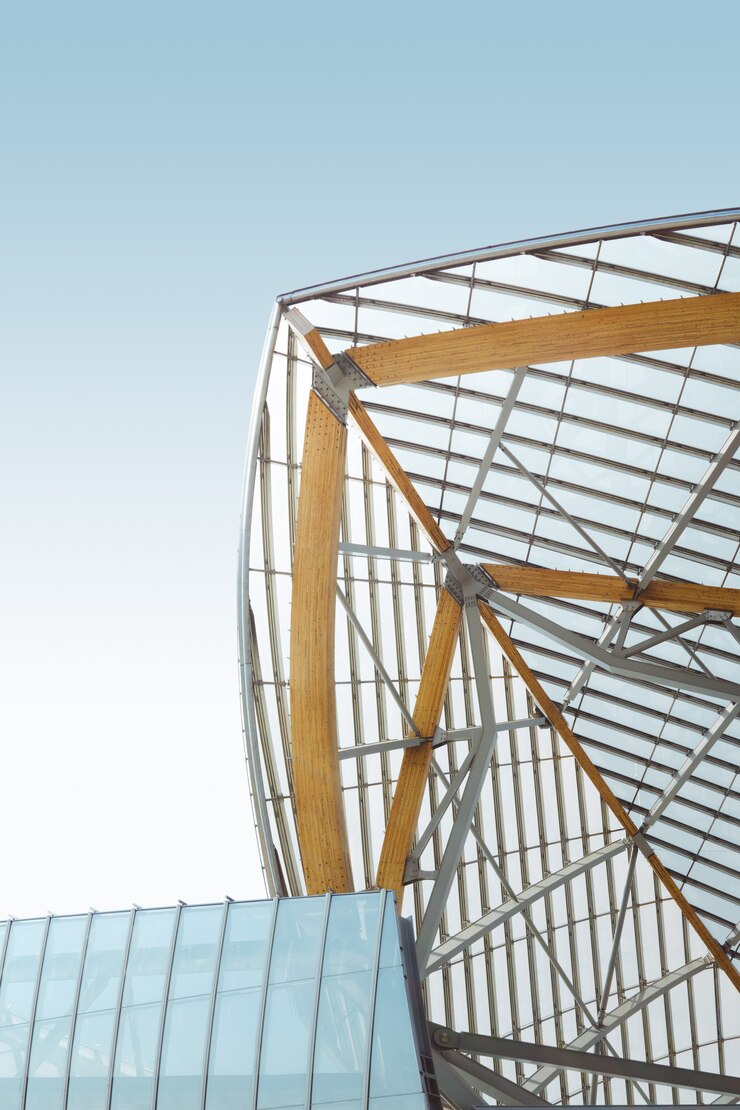 Free Photo vertical low angle shot of a metal and wooden building under the blue sky