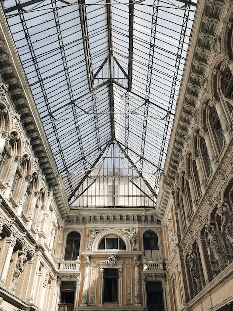 Vertical low angle shot of an Odessa passage ceiling made of glass with sculpted walls