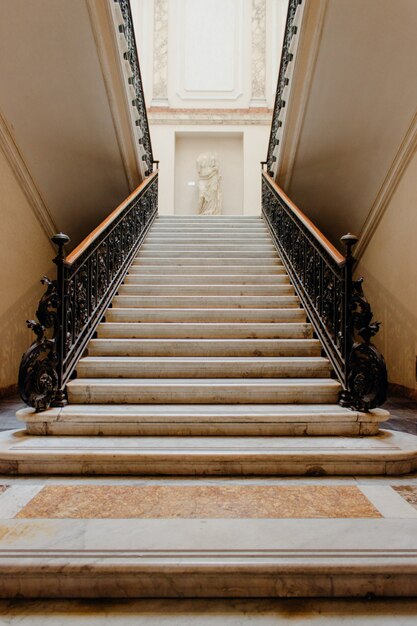 Vertical low angle shot of a staircase inside a beautiful historic building